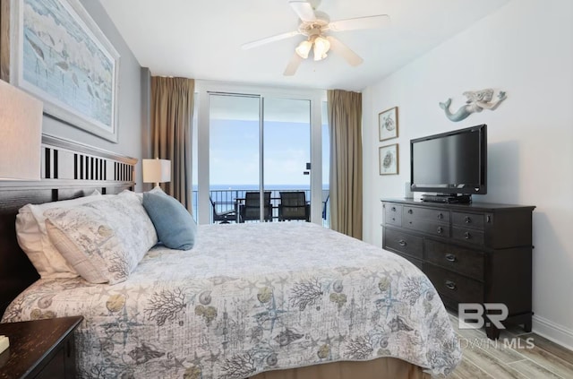 455 E Beach Blvd Unit 807, Gulf Shores, AL 36542 - bedroom with wood finished floors, ceiling fan, and baseboards