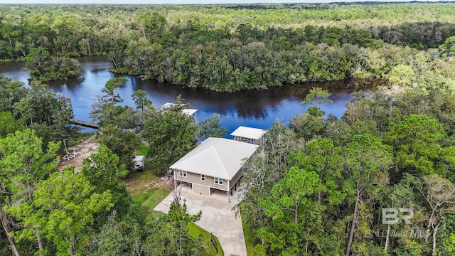 bird's eye view with a water view and a view of trees