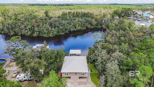 aerial view with a water view and a view of trees