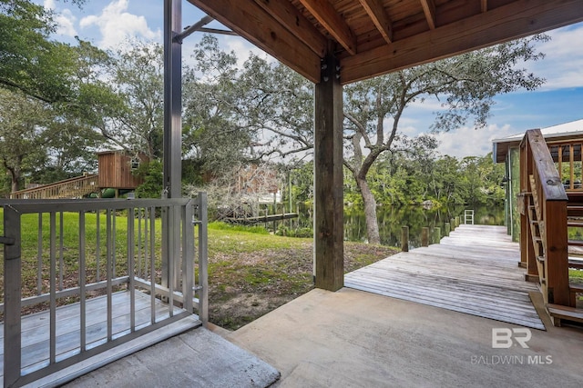 view of patio featuring a boat dock