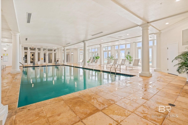 view of pool with ornate columns