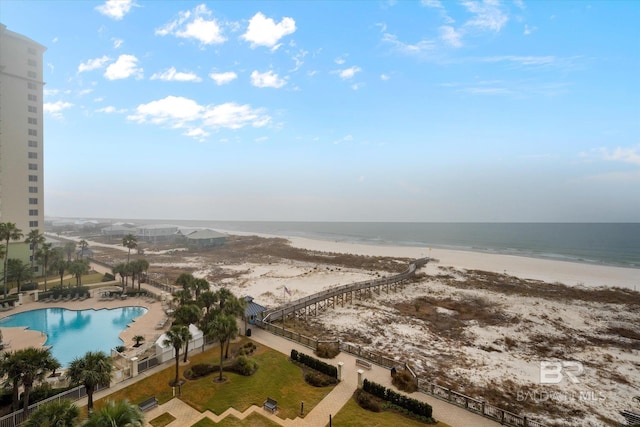 bird's eye view featuring a water view and a beach view