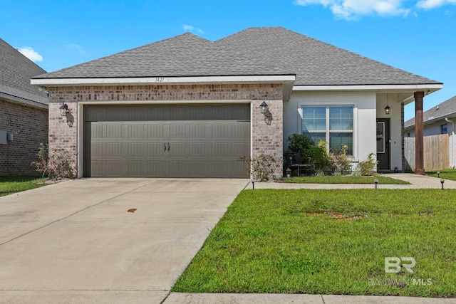 view of front of home with a garage and a front yard