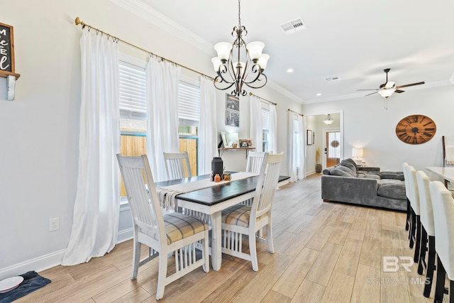 dining area with crown molding, light hardwood / wood-style flooring, and ceiling fan with notable chandelier