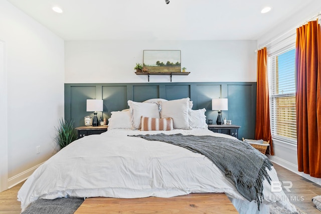 bedroom with light hardwood / wood-style floors