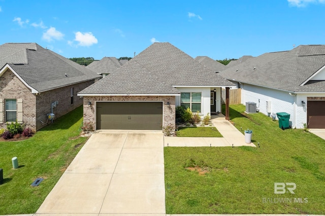 view of front of property with a garage, a front yard, and cooling unit