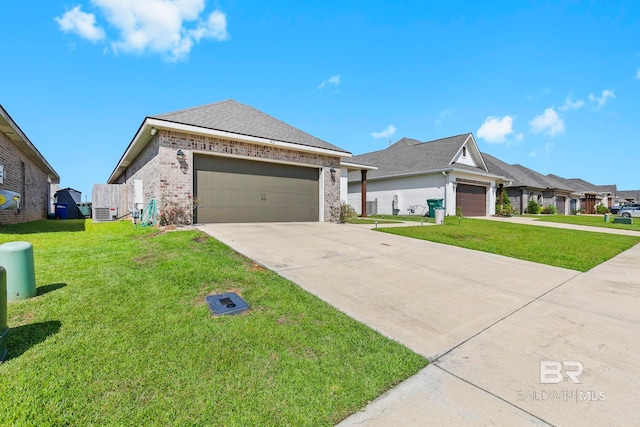 view of front of property with a garage and a front lawn