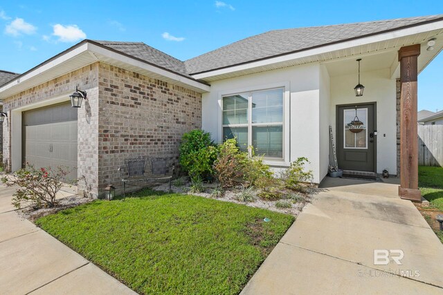 view of front of home with a garage and a front yard