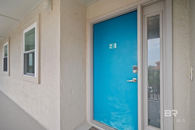 27222 Gulf Rd, Orange Beach, AL 36561 - property entrance featuring stucco siding