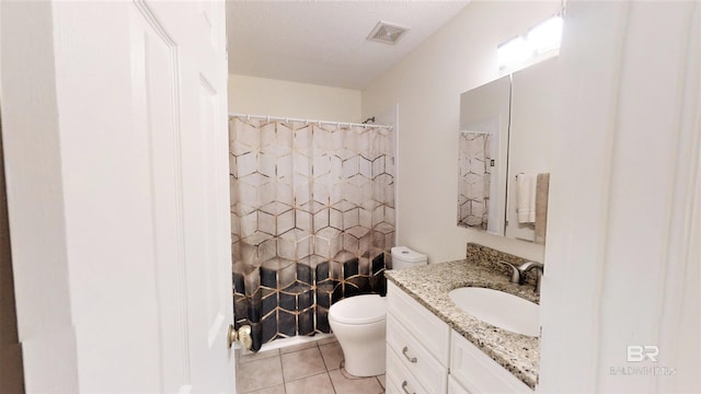 bathroom featuring tile patterned flooring, a shower with shower curtain, vanity, a textured ceiling, and toilet