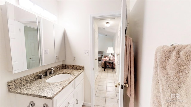 bathroom with vanity and tile patterned flooring