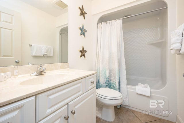 full bathroom featuring tile patterned flooring, vanity, shower / tub combo with curtain, and toilet