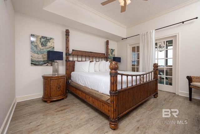 bedroom with ceiling fan, light wood-type flooring, and ornamental molding