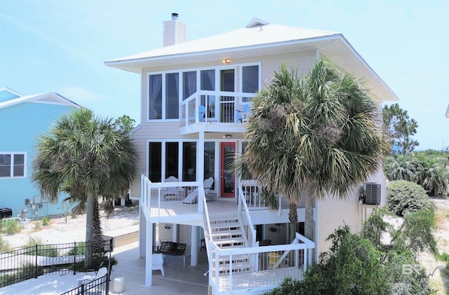 rear view of property featuring central air condition unit