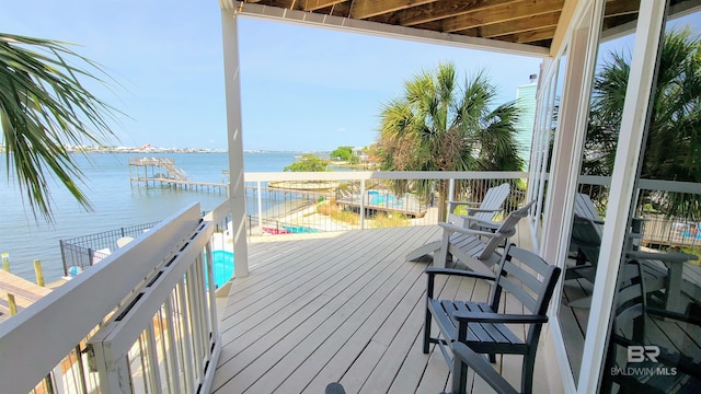 wooden deck featuring a water view