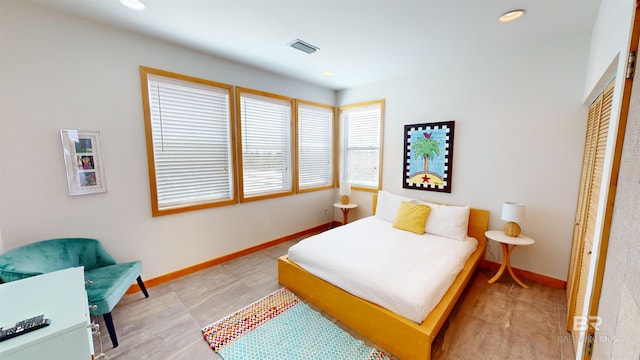 bedroom featuring tile flooring and white fridge