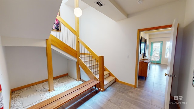 stairs featuring tile floors