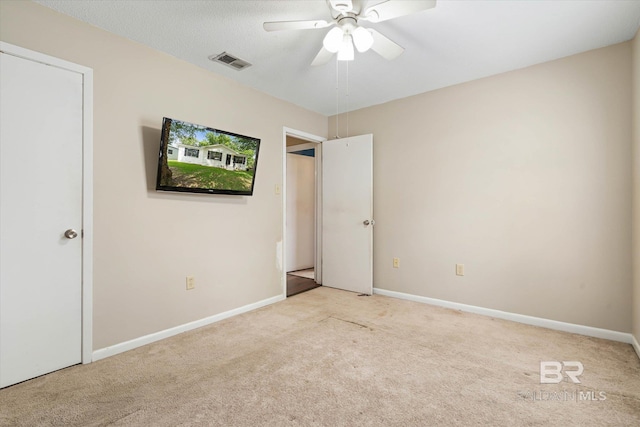 2132 S Pine St, Loxley, AL 36551 - unfurnished bedroom featuring carpet and a ceiling fan