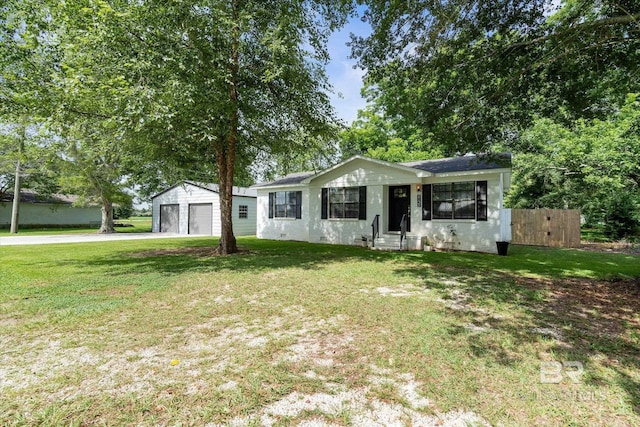 2132 S Pine St, Loxley, AL 36551 - ranch-style home featuring a detached garage, an outbuilding, and entry steps