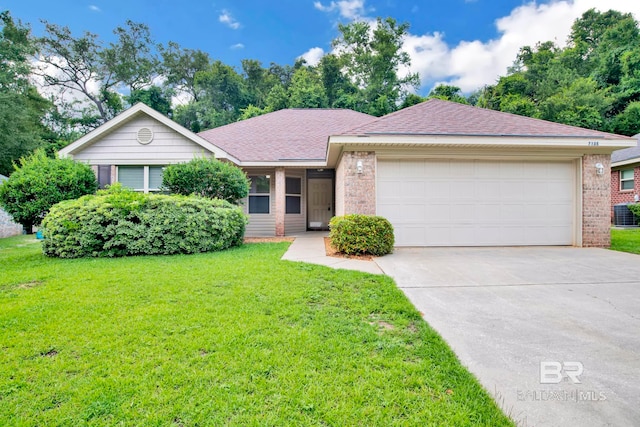 single story home with a garage and a front yard