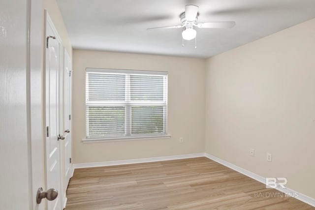 spare room with ceiling fan and light hardwood / wood-style floors