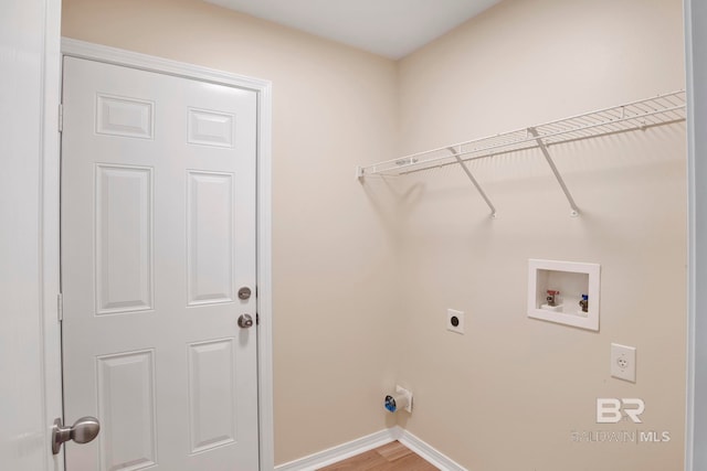 laundry area with electric dryer hookup, washer hookup, and wood-type flooring