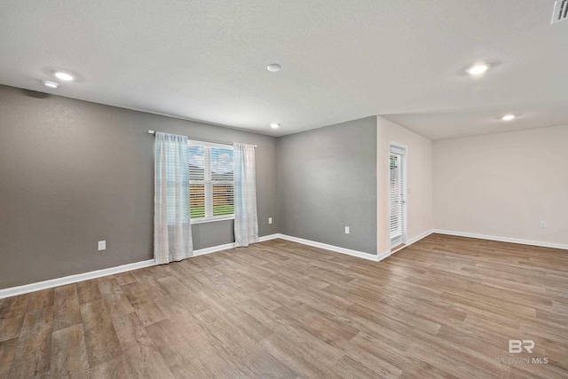24193 Lanai Ln, Elberta, AL 36530 - unfurnished room with wood finished floors and recessed lighting