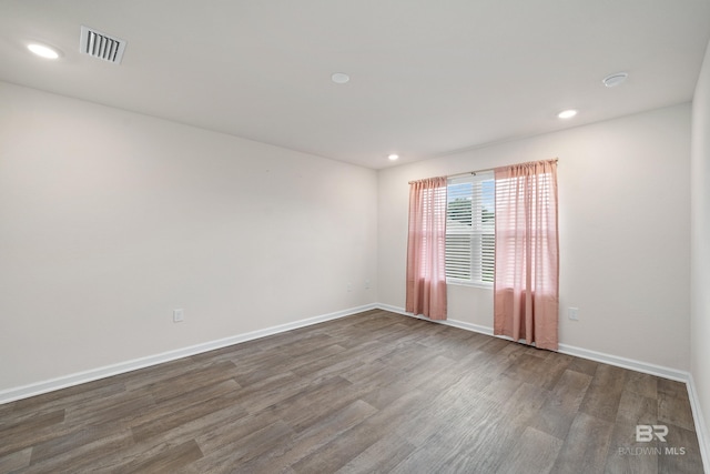 24193 Lanai Ln, Elberta, AL 36530 - empty room with dark wood-style flooring and recessed lighting