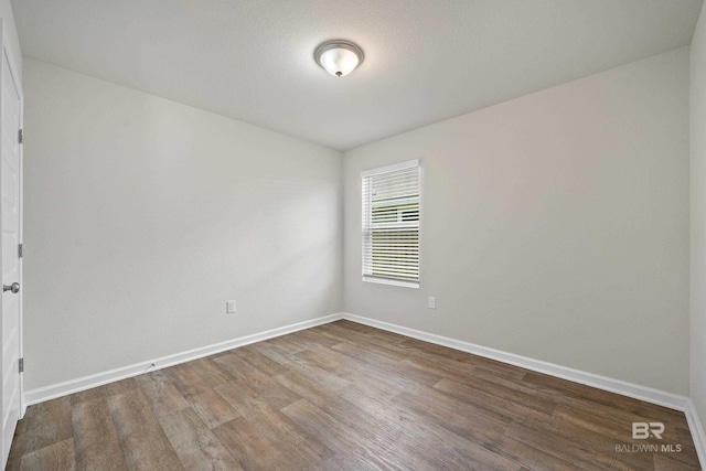 24193 Lanai Ln, Elberta, AL 36530 - unfurnished room featuring wood finished floors and baseboards