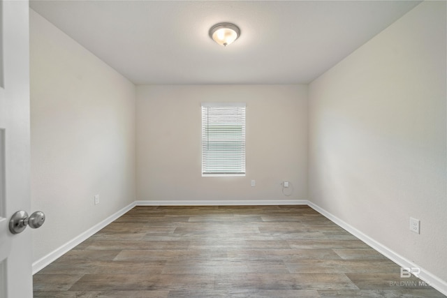24193 Lanai Ln, Elberta, AL 36530 - empty room featuring wood finished floors and baseboards