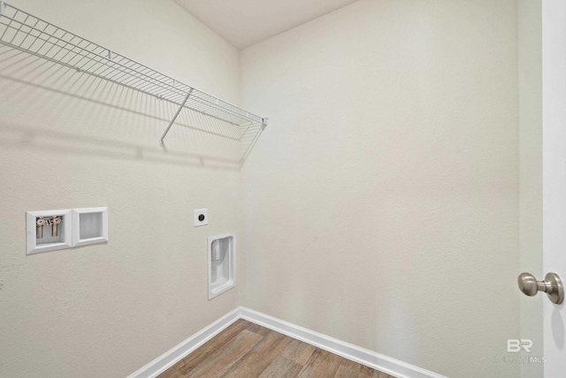 24193 Lanai Ln, Elberta, AL 36530 - washroom featuring dark wood-style floors, hookup for an electric dryer, and washer hookup