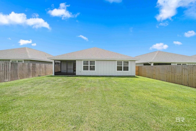 24193 Lanai Ln, Elberta, AL 36530 - rear view of house with a fenced backyard, a sunroom, and a shingled roof