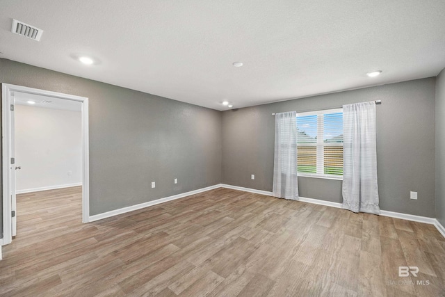 24193 Lanai Ln, Elberta, AL 36530 - spare room with wood finished floors and recessed lighting