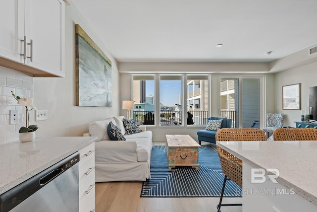 living room with light hardwood / wood-style flooring