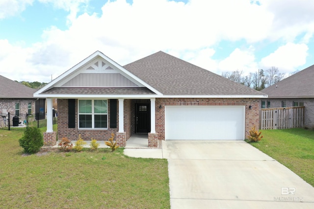 craftsman-style home featuring a front yard, fence, brick siding, and a shingled roof