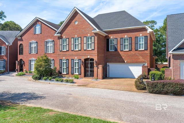 107 Fielding Pl, Mobile, AL 36608 - view of front facade with brick siding, concrete driveway, and a garage