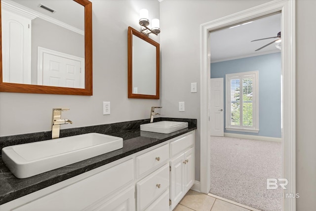 107 Fielding Pl, Mobile, AL 36608 - full bath with crown molding, ceiling fan, double vanity, baseboards, and tile patterned flooring