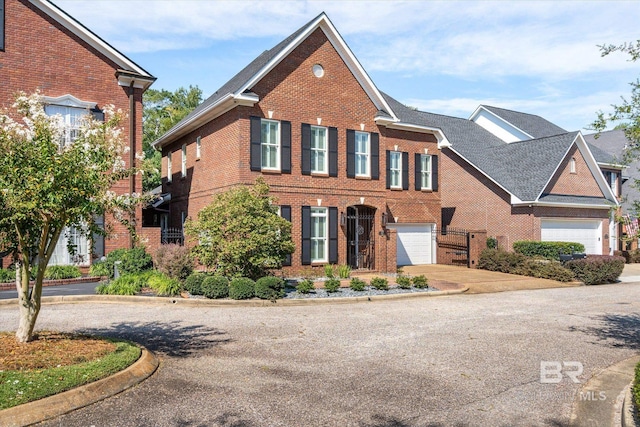 107 Fielding Pl, Mobile, AL 36608 - view of front of home with concrete driveway, brick siding, and an attached garage
