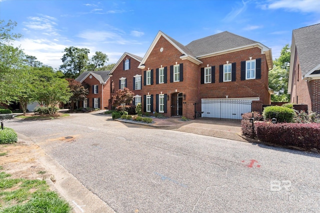 107 Fielding Pl, Mobile, AL 36608 - view of front facade with a garage, brick siding, and concrete driveway