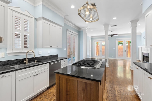 107 Fielding Pl, Mobile, AL 36608 - kitchen featuring ornate columns, a sink, appliances with stainless steel finishes, crown molding, and french doors