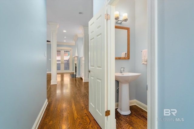 107 Fielding Pl, Mobile, AL 36608 - hallway with dark wood finished floors, baseboards, crown molding, recessed lighting, and a sink
