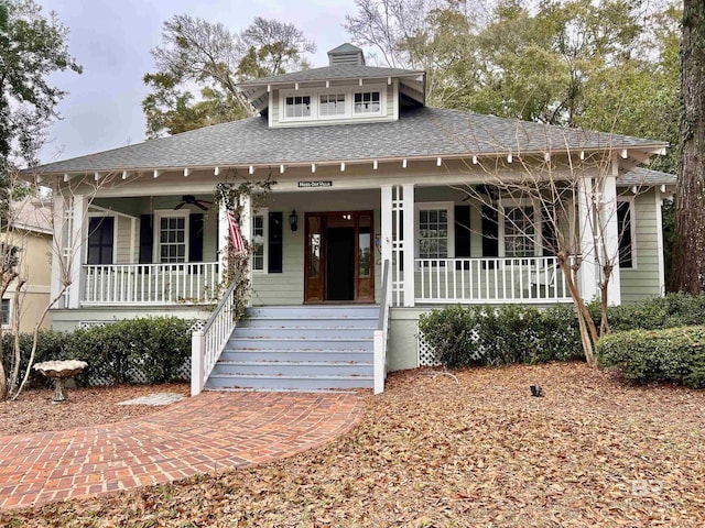 view of front of house with ceiling fan and a porch