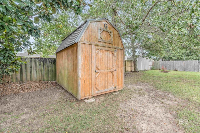 view of outbuilding with a yard