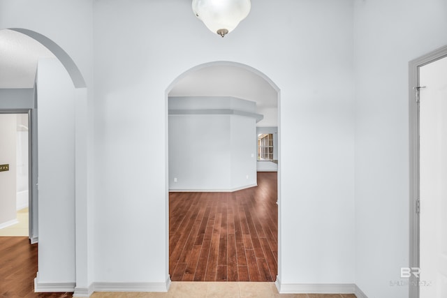 corridor featuring hardwood / wood-style floors