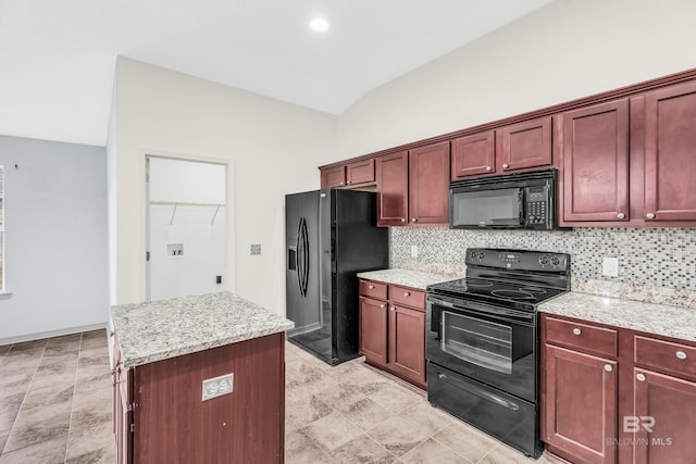 kitchen with black appliances, vaulted ceiling, tasteful backsplash, a kitchen island, and light stone counters