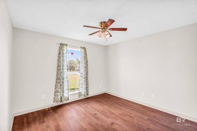 empty room featuring ceiling fan and wood-type flooring