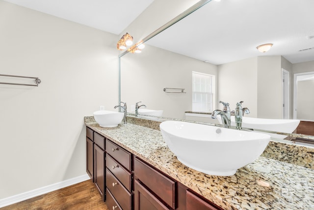 bathroom featuring vanity and wood-type flooring