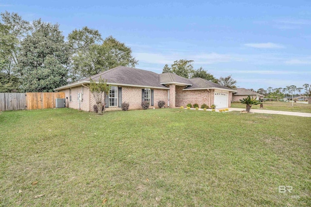 ranch-style home featuring a front lawn, central AC unit, and a garage