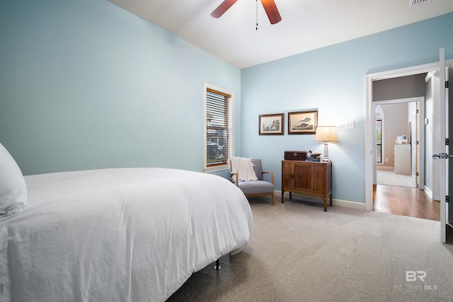 bedroom featuring ceiling fan, carpet floors, visible vents, and baseboards