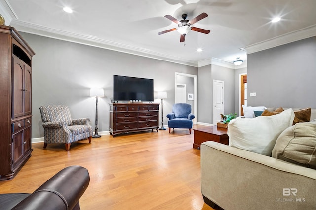 living room with ceiling fan, light wood-style flooring, recessed lighting, baseboards, and crown molding